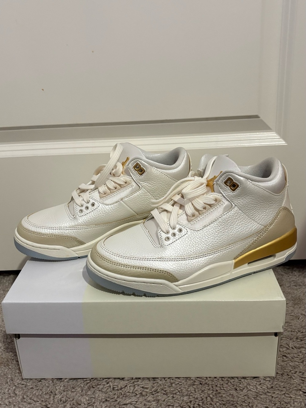 Jordan Retro Sneakers in White and Gold